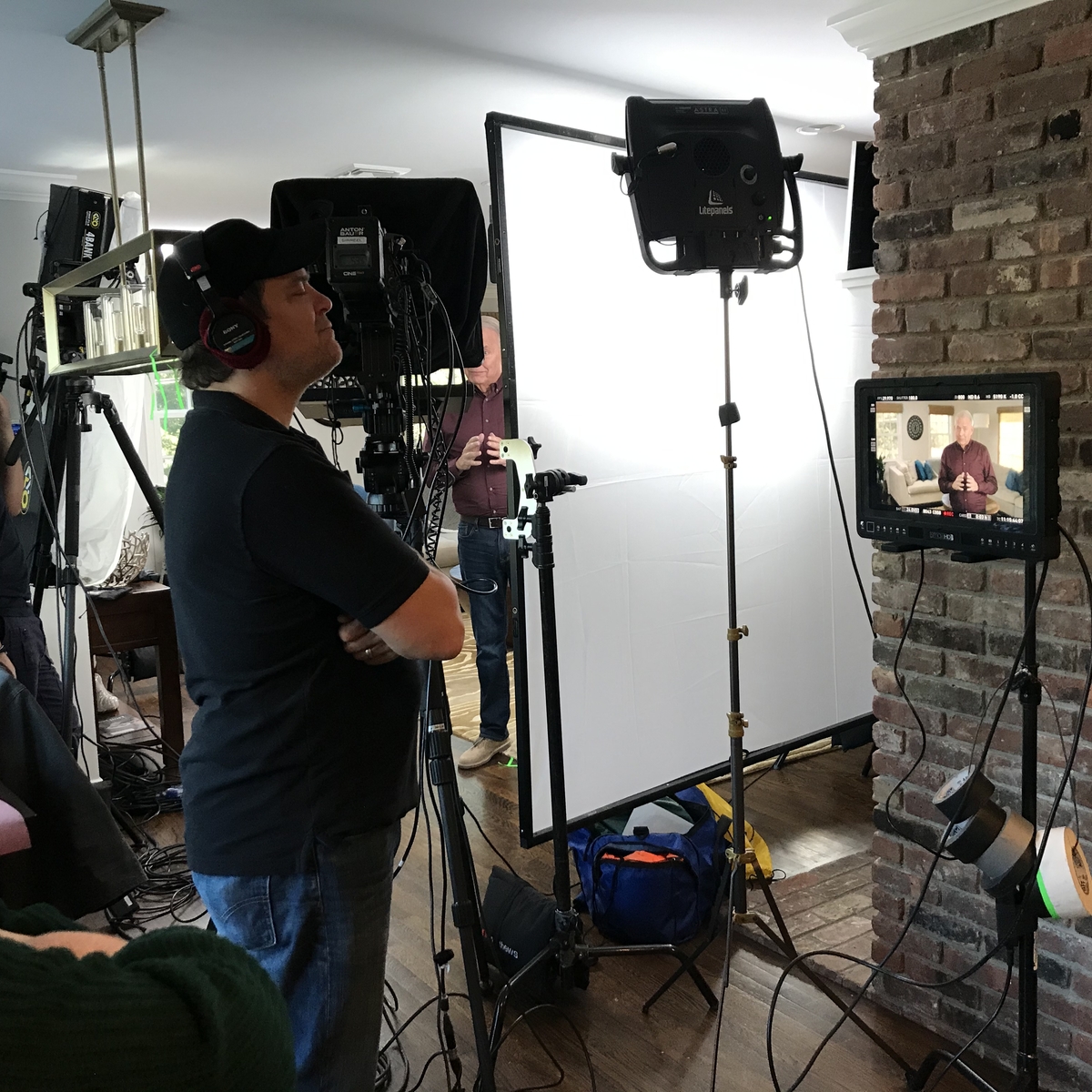 Production crew with monitors and lighting on set